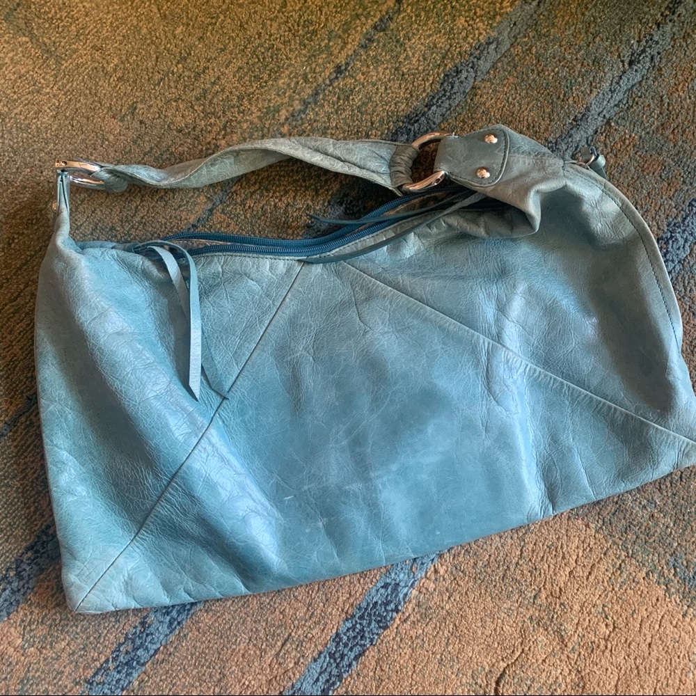 This is a wonderful vintage hide leather hobo styled bag by Hobo International.